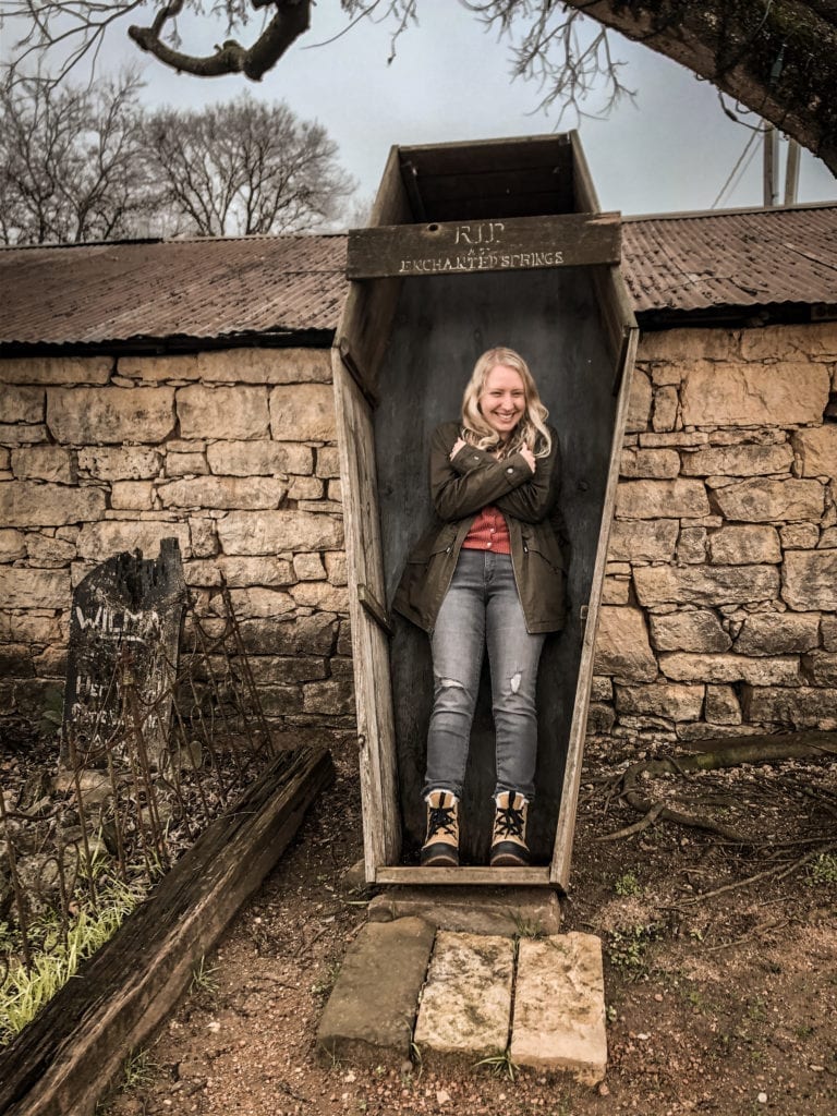 Take a photo in the coffin at Enchanted Springs Ranch