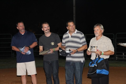 Guests receiving awards for six gun fast draw at Corporate Event