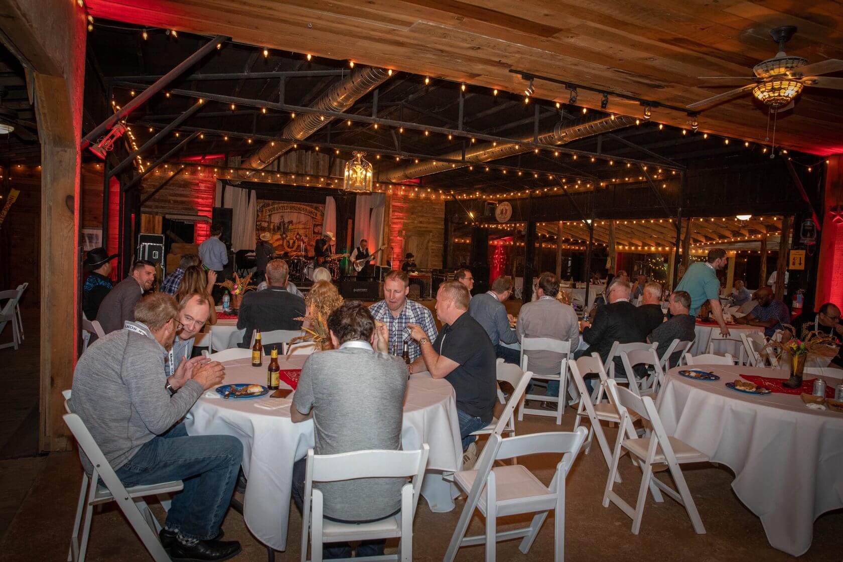 A corporate group enjoying a business dinner at Enchanted Springs Ranch
